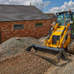 JCB 1CXT Backhoe Loader on construction site.