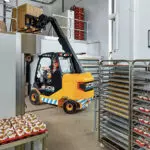 JCB 66-40E electric teletruk lifting goods in a bakery.
