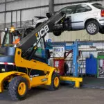 JCB 77-52D diesel teletruk lifting an automobile.