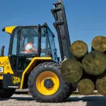 JCB 930 Rough Terrain Forklift carrying logs.