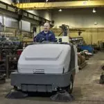 Advance Proterra professional sweeper cleaning steel workshop floors.