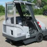Advance Proterra rider sweeper with cab.
