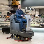 Advance SC4000 ride-on professional scrubber cleaning market floors.