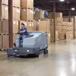 Advance SC8000 cleaning indoor warehouse floors.