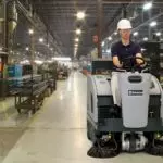 Advance SW4000 rider sweeper cleaning work shop floors.