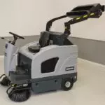 Advance SW4000 sweeper, dumper lifted.