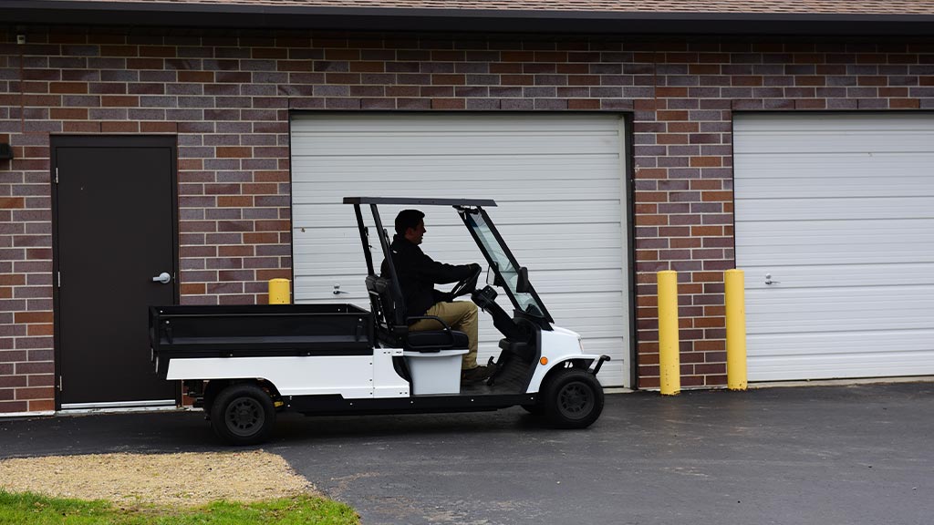 Columbia Journeyman utility vehicle driving outdoors.