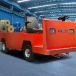 Red Columbia Payloader burden carrier in shop.