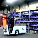 Employee picking materials and placing them on Columbia Stockchaser.