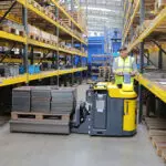Combilift Combi-PPT 3,000 kg to 16,000 kg pedestrian stacker in warehouse.