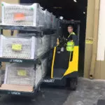 Combilift Combi-MR Reach Truck transporting vinyl, siding and roofing materials.
