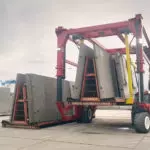 Combilift COMBI-SC3 Special Applications Straddle Carrier moving concrete slabs.