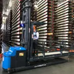 Combilift Combi-OP Order Picker in action in warehouse, side view.
