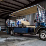 Cushman Shuttle 2 cargo bed full of materials.