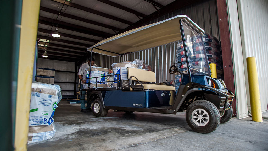 Cushman Shuttle 2 cargo bed full of materials.