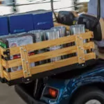 Cushman Shuttle 4 burden carrier cargo bed full of materials.