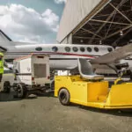 Cushman Tug 8K tow tractor outdoors at an airport.