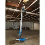 Genie AWP-30S aerial work platform raised to ceiling.