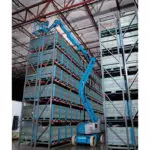 Genie Z-40/23 N boom lift in warehouse aisle.