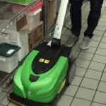 IPC Eagle CT5 walk-behind scrubber cleaning restaurant floor.