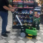 IPC Eagle CT5 walk-behind scrubber cleaning store floor.