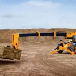 JCB 514-56 Telehandler with extended boom lifting wood planks.