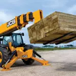JCB 514-56 Telehandler lifting lumber.