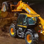 JCB 542-70 Agri telescopic handler dumping dirt.