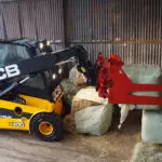 JCB 77-52D diesel teletruk lifting hay bales.