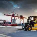 JCB 77-52D diesel teletruk driving outdoors.