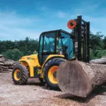 JCB 950 rough terrain forklift lifting a large log.