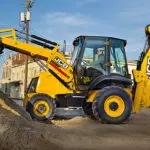 JCB 3CX-14 Backhoe Loader stock piling.
