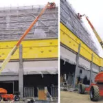 JLG 1350SJP boom lifts raising workers to provide building maintenance.