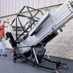 JLG 25AM push around vertical mast lift being transported.