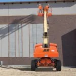 JLG 600S telescopic boom lift at jobsite.