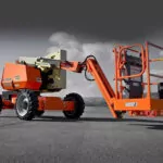 JLG H340AJ Hybrid aerial boom lift outdoors.