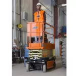 Operator driving on JLG R1932 electric scissor lift.