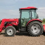 side of Mahindra 2670 compact utility tractor with cab.