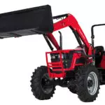 Mahindra 6075 utility tractor with bucket lifted.