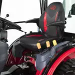 Mahindra eMax 25L HST cab tractor operator area.