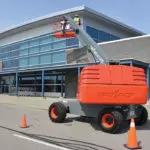 back of Skyjack SJ40/45 T+ telescopic boom lifting operator up.