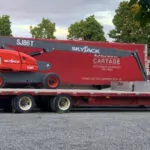 Skyjack SJ82/86 T telescopic boom lift on a trailer.