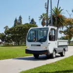Taylor-Dunn Bigfoot 3000 Burden Carrier Utility Vehicle outdoors.