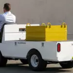 Taylor-Dunn Bigfoot XL Utility Vehicle driving with box on back.