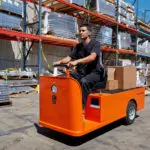 Taylor-Dunn C-432 Burden Carrier Utility Vehicle in action outdoors.