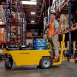 Taylor-Dunn SC-100 Stock Chaser utility vehicle in warehouse.