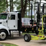 Donkey 5K forklift raising pallet onto truck trailer.