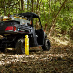 Polaris Commercial PRO XD Full-Size Diesel Utility Vehicle back view on dirt trail.