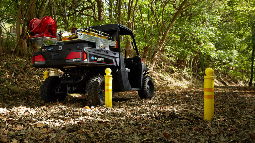 Polaris Commercial PRO XD Full-Size Diesel Utility Vehicle back view on dirt trail.