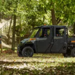 Pro XD Full-Size Gas Crew Utility Vehicle by Polaris Commercial with doors on dirt trail.